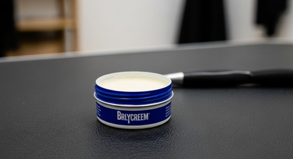 "Brylcreem wax tin on the bathroom shelf."